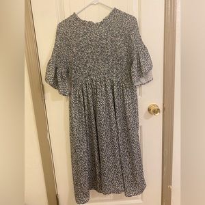 Large smocked maxi blue dress with white flowers.